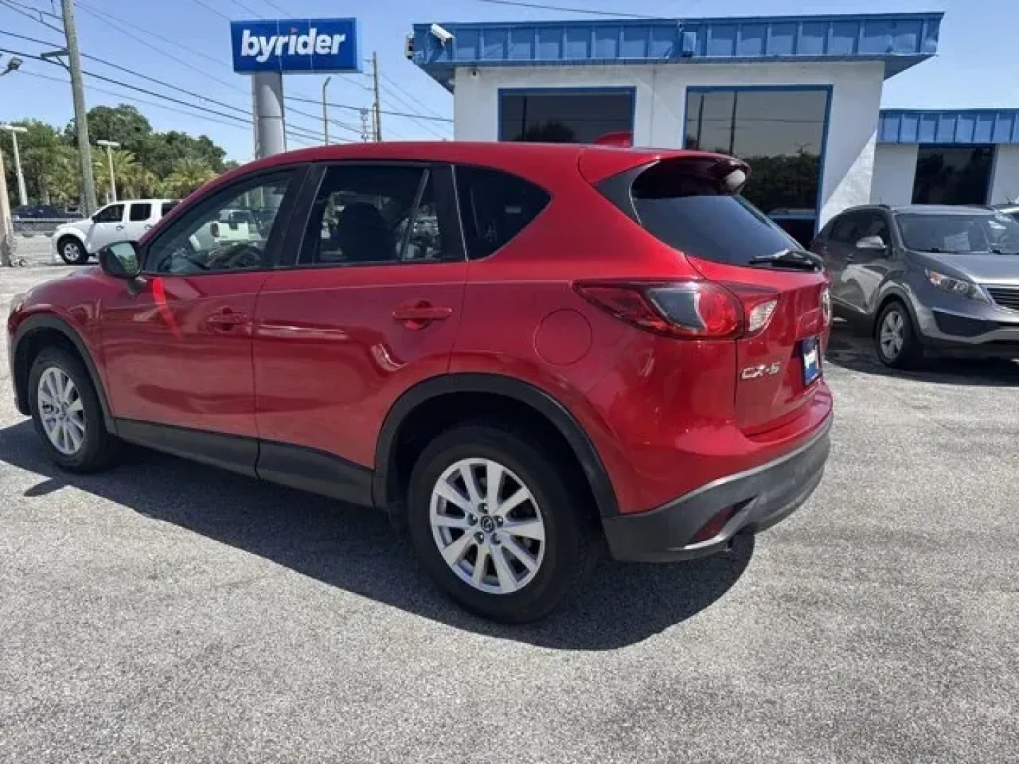 2015 Mazda CX-5 (JM3KE2CY1F0) with an Other engine, AUTOMATIC transmission, located at 1285 Cassat Ave, Jacksonville, FL, 32205, (904) 425-3000, 30.299780, -81.732430 - IIHS Top Safety Pick+. Boasts 32 Highway MPG and 25 City MPG! This Mazda CX-5 delivers a Regular Unleaded I-4 2.5 L/152 engine powering this Automatic transmission. WHEEL LOCKS, SOUL RED METALLIC PAINT, Wheels: 17 x 7J Aluminum Alloy.*This Mazda CX-5 Comes Equipped with These Options *Wheels w/Silve - Photo#4